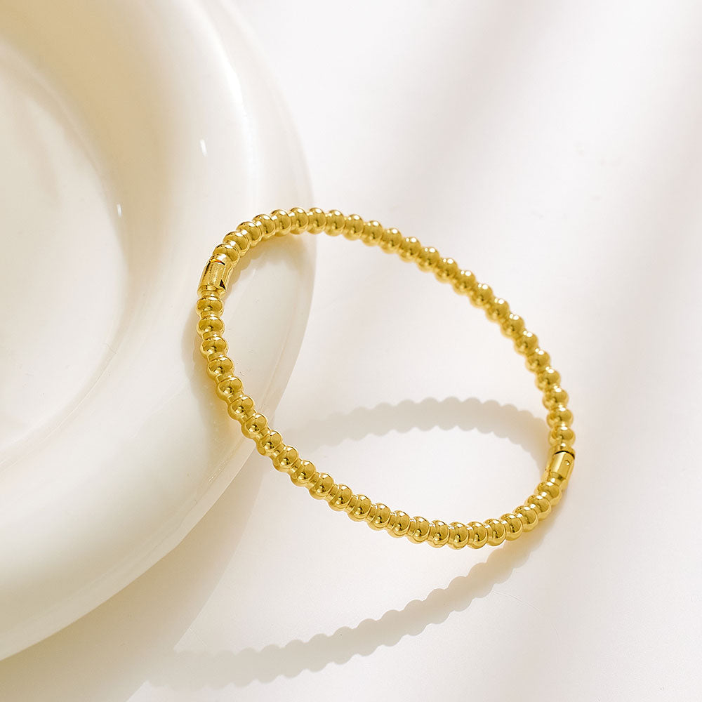 Perlen-Schnapparmband aus Edelstahl mit 18 Karat Goldbeschichtung