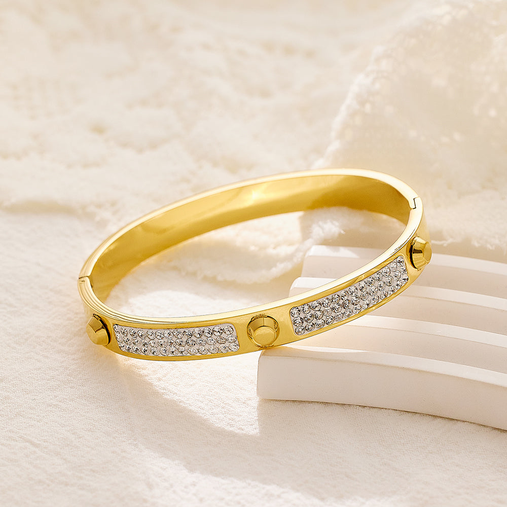 Armband aus Edelstahl mit 18 Karat Gold überzogen und dreifachem Nagelschlamm
