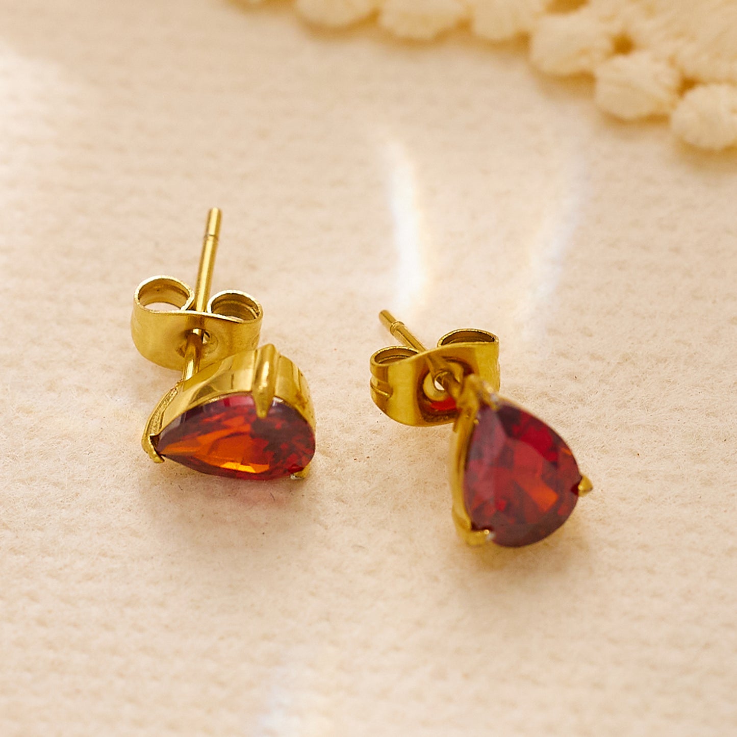 Stainless steel plated red diamond earrings in 18-karat gold