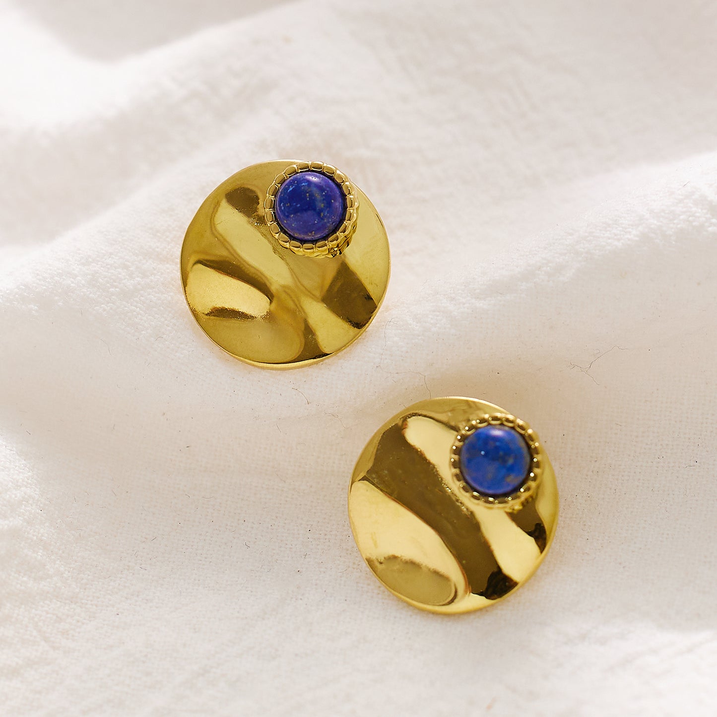 Stainless steel plated 18-karat gold earrings with blue eyes