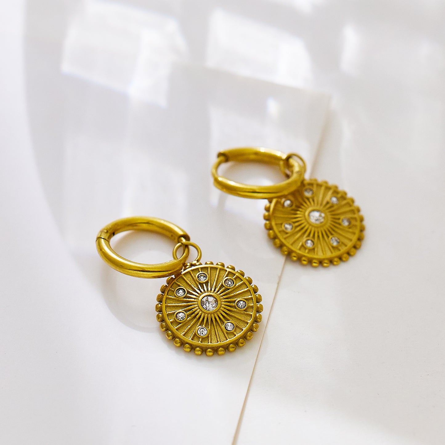 Stainless steel plated 18k gold round cake earrings