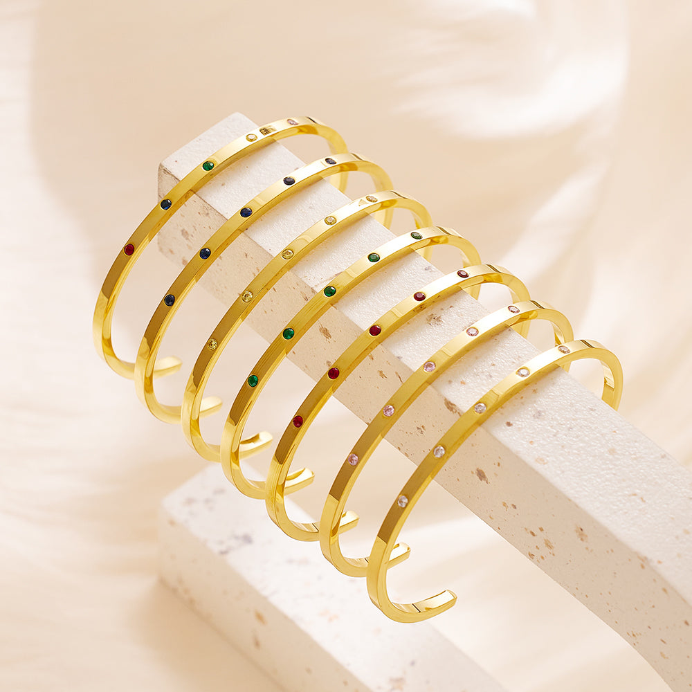 Edelstahlarmband mit 18 Karat Goldbeschichtung und fünf kleinen Diamanten