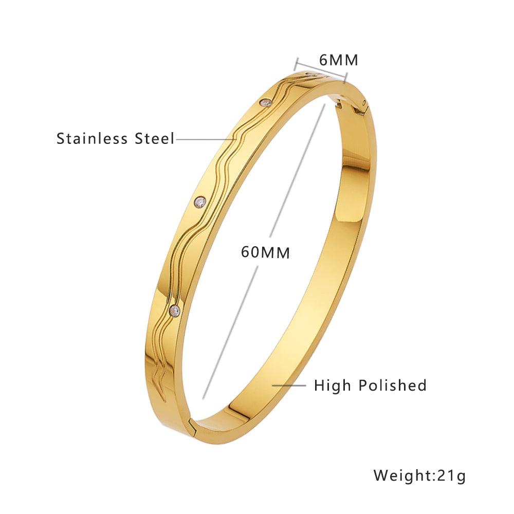 Gewelltes Armband aus Edelstahl mit 18 Karat Goldbeschichtung und Diamanten