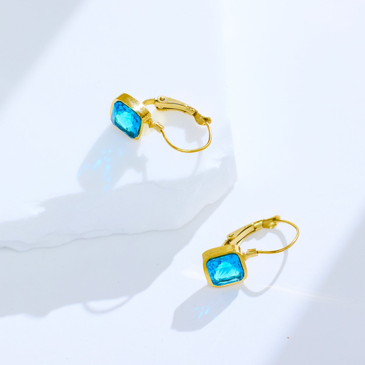 Stainless steel plated 18-karat gold with blue diamond earrings