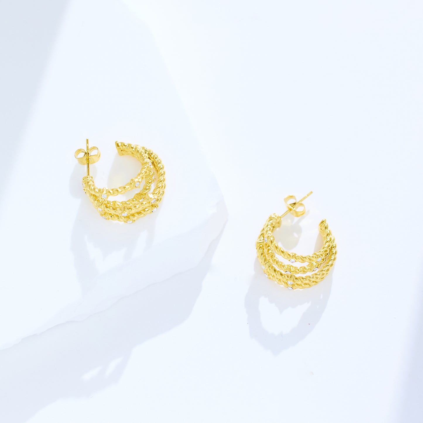 18-karat gold cord earrings in stainless steel