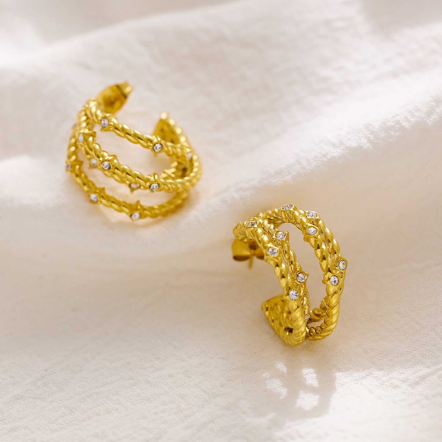 18-karat gold cord earrings in stainless steel