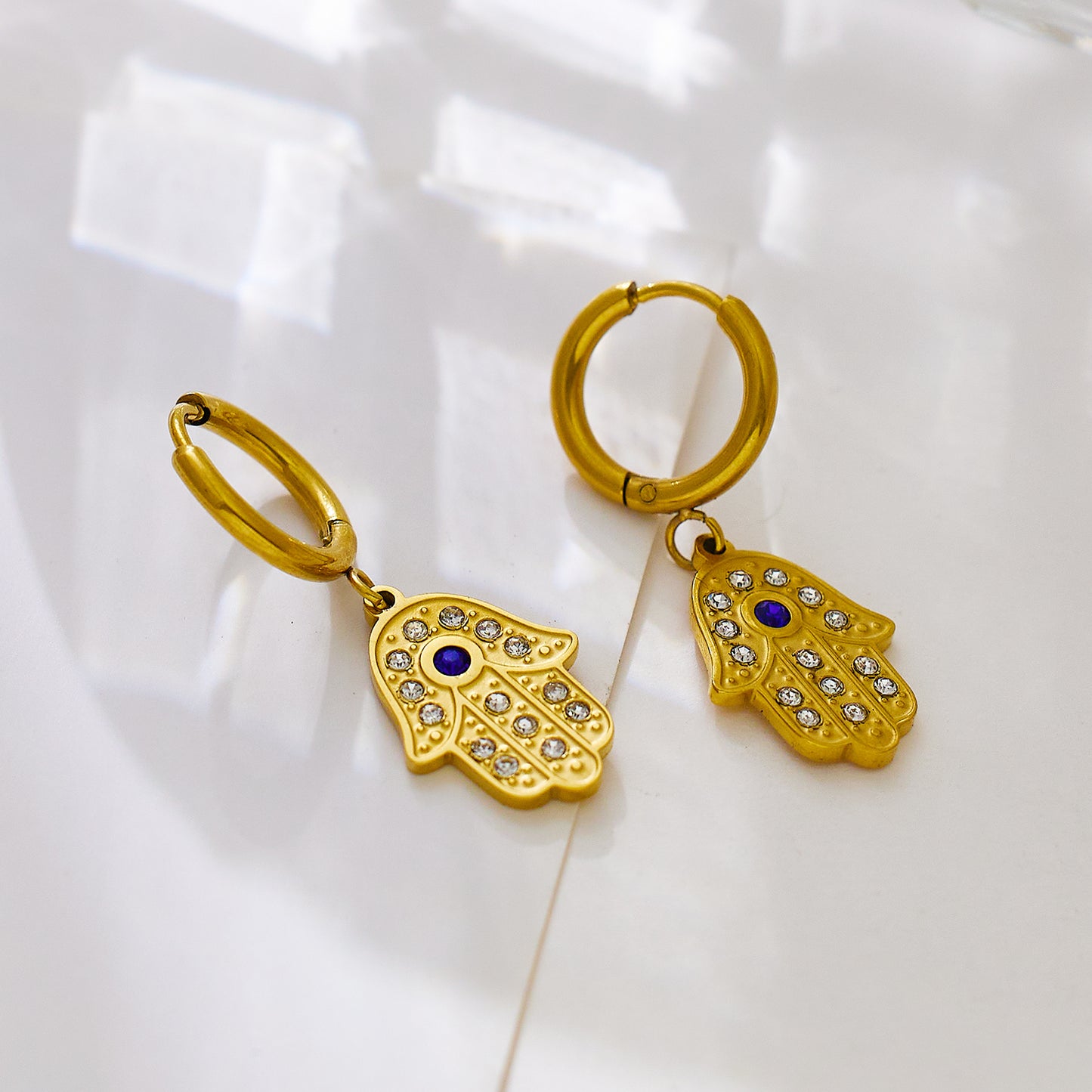 Stainless steel plated 18-karat gold palm with diamond earrings