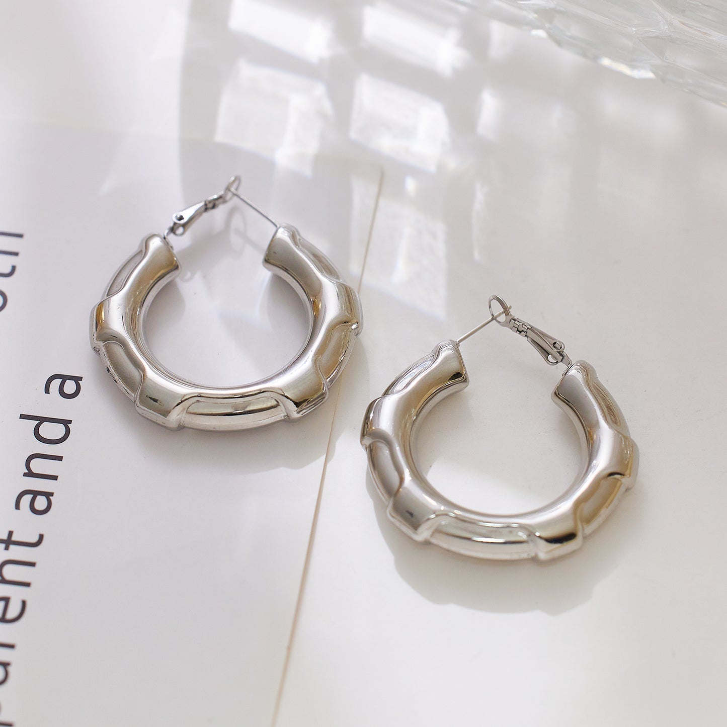 Stainless steel plated 18-karat gold hexagonal semi-closed loop earrings