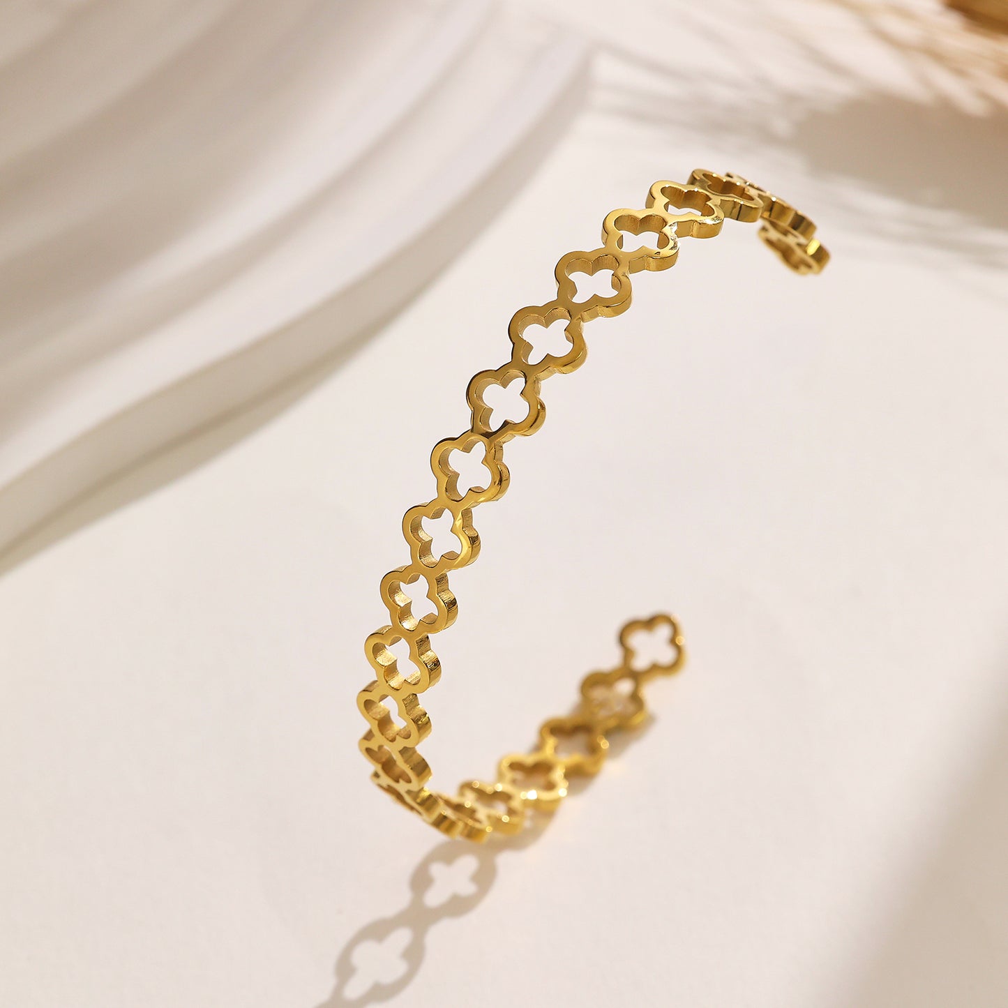 Stainless steel plated 18-karat gold half-open bracelet